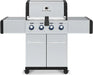 Broil King Regal S 420 Pro stainless gas grill, front view with four blue-lit control knobs and dual cabinet doors