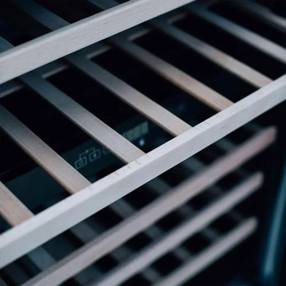 Close-up of Summerset RFR-24W wood wine racking inside the stainless steel outdoor cooler.