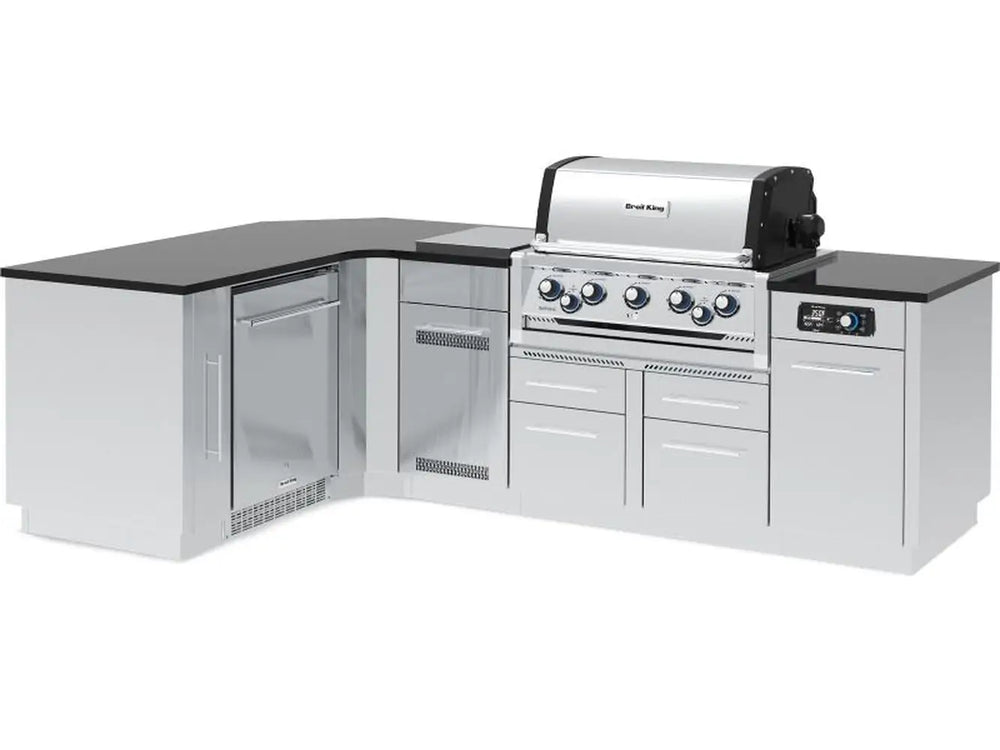 Fully assembled L-shaped Broil King Imperial QS 590iJ outdoor kitchen island featuring a built-in 5-burner grill, integrated refrigerator, and smart iQue technology interface.