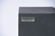 Close-up of the Elementi brand logo on the dark gray concrete finish of the Granville OFG121DG Fire Table.
