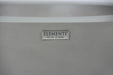 Close-up of the Elementi: The Art of Living silver logo plate on the side of a gray concrete fire pit.