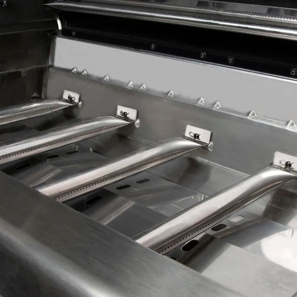 Close-up of stainless steel tube burners inside Broil King Regal S 420 Pro gas grill firebox