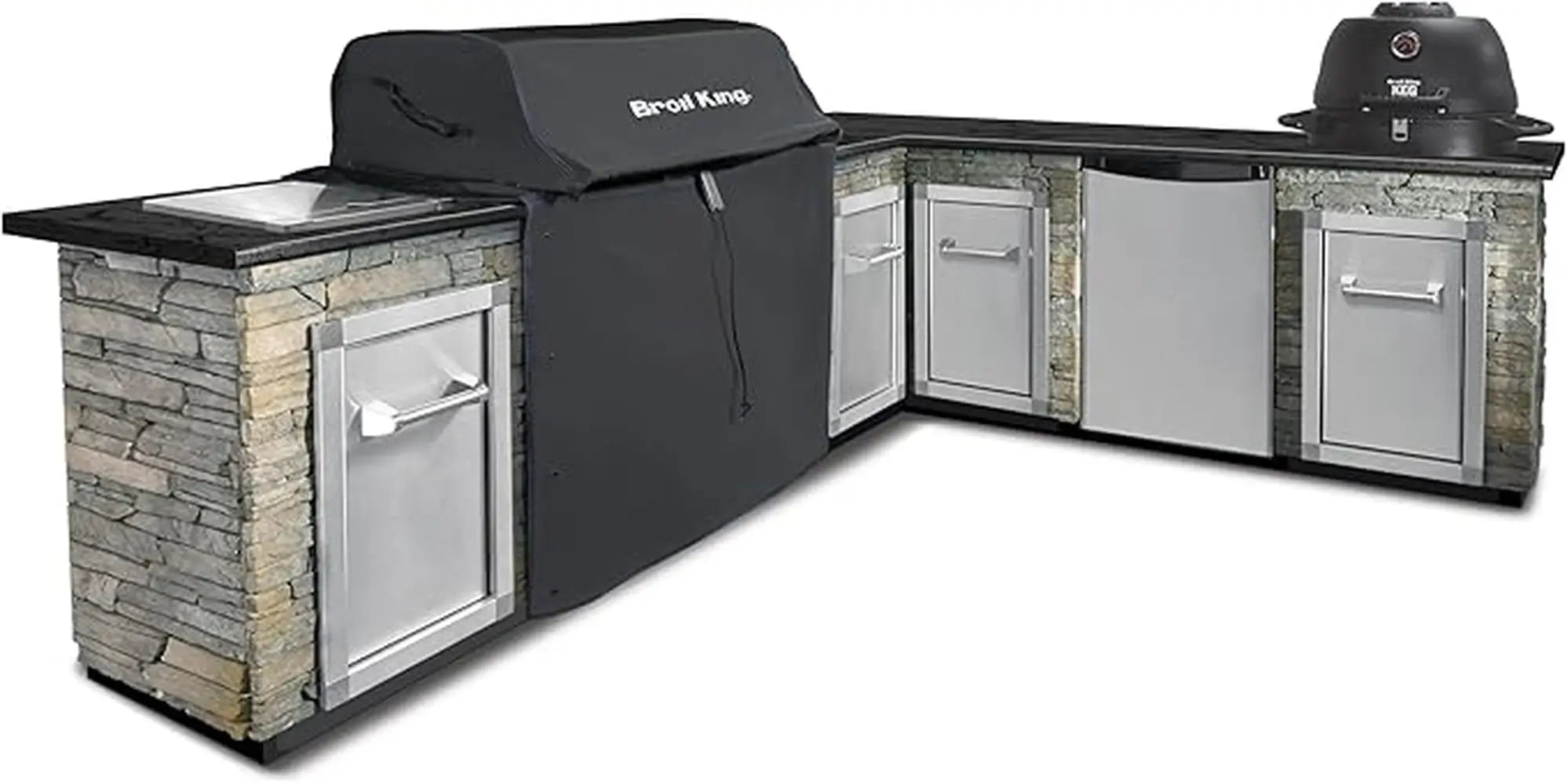 Broil King 68592 grill cover for Imperial 500, shown on a built-in grill in a stone outdoor kitchen island.
