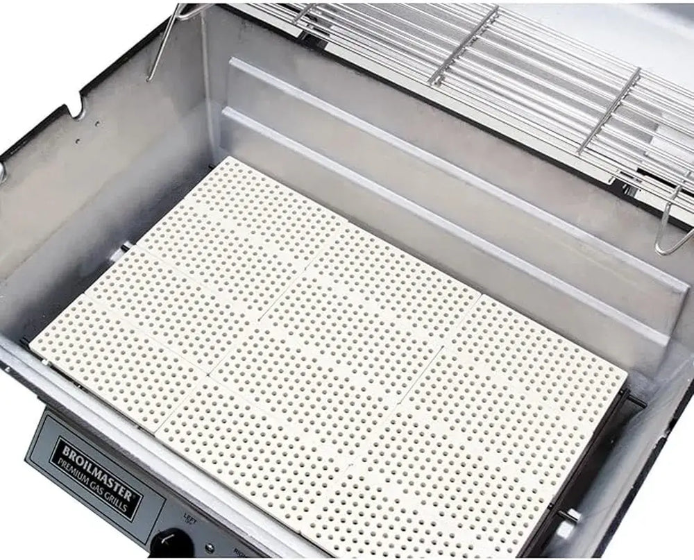 White ceramic infrared briquettes installed in the Broilmaster grill for superior heat retention and infrared cooking