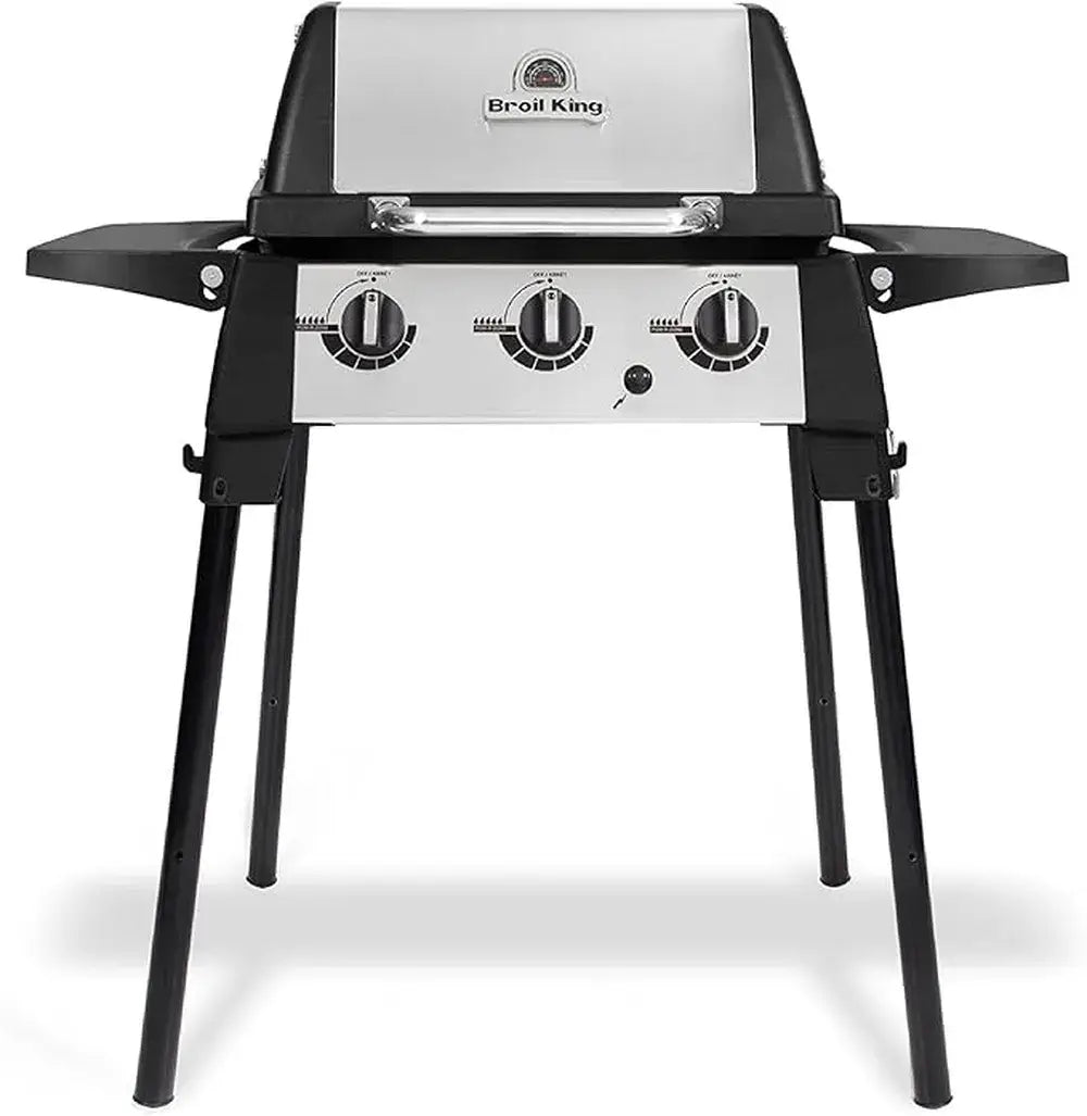 Broil King Porta-Chef 320 portable gas grill on foldable black stand with stainless steel lid, three burner control knobs, and dual side shelves, shown front-facing on a light gray background.