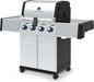 Broil King Regal S 420 Pro stainless gas grill, angled right-front view with closed lid and stainless side shelves