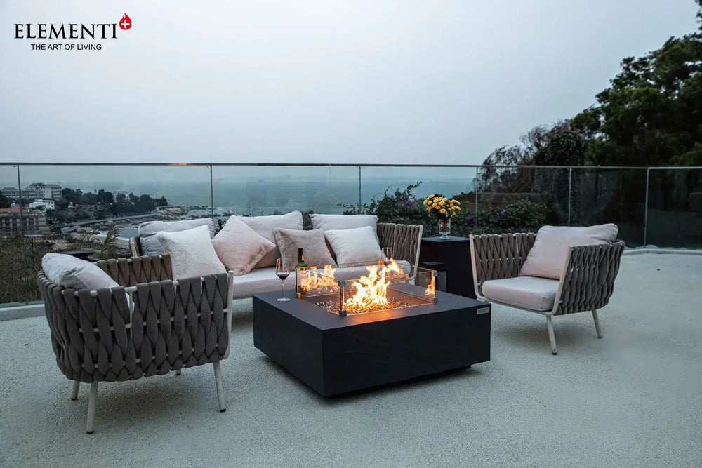 Modern outdoor lounge featuring the Roraima rectangular fire pit table and designer patio furniture.