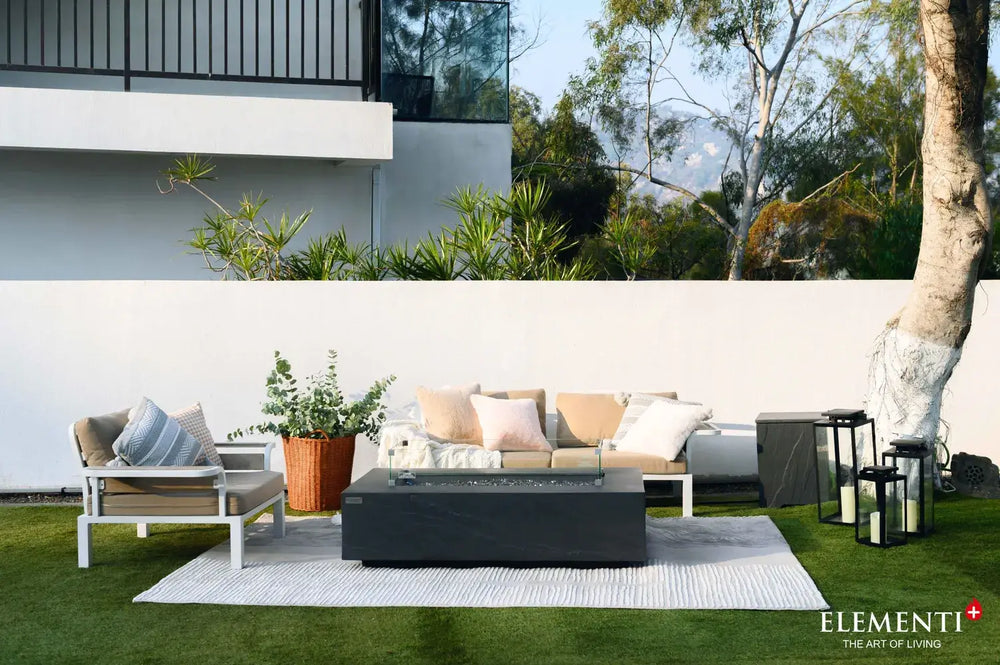 Modern outdoor lounge featuring the Cape Town rectangular fire pit table and designer seating.