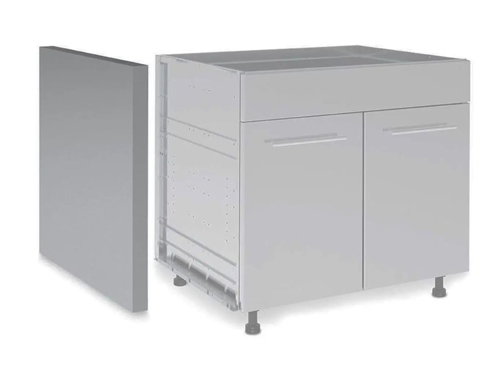 A Broil King 800050 Side Panel Finish being installed on a modular outdoor kitchen cabinet unit, illustrating how it covers exposed cabinet sides and legs for a finished look.