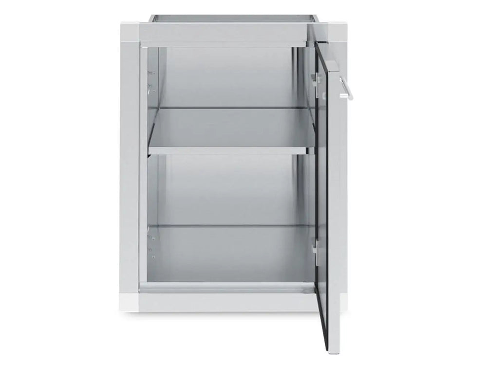 Interior view of the Broil King 800110 outdoor cabinet showing a spacious storage compartment with an adjustable stainless steel shelf and right-swing door.