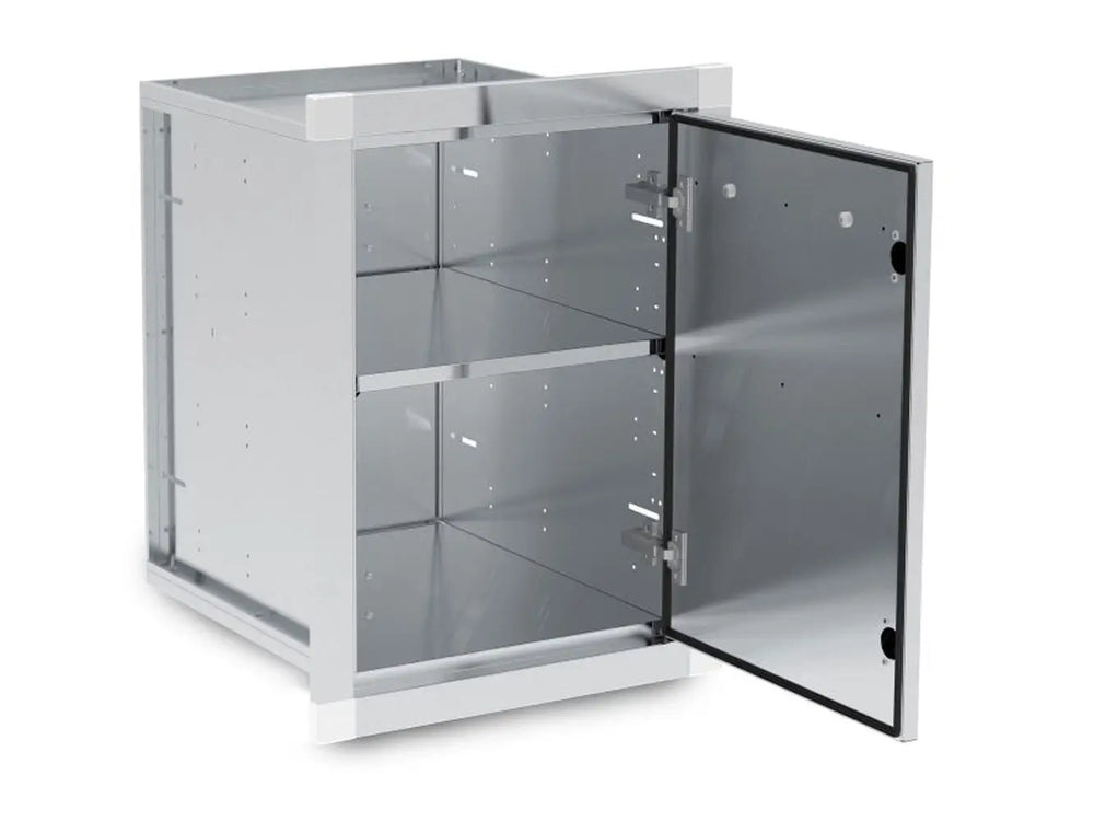 Angled view of the Broil King 800110 storage assembly with the door open, showcasing the magnetic closure, interior shelving, and heavy-duty hinges for BBQ island integration.