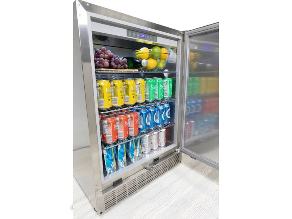 Interior shot of the Broil King 800149 outdoor fridge stocked with beverages and fruit, highlighting the bright LED lighting and spacious storage.