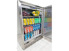 Interior shot of the Broil King 800149 outdoor fridge stocked with beverages and fruit, highlighting the bright LED lighting and spacious storage.
