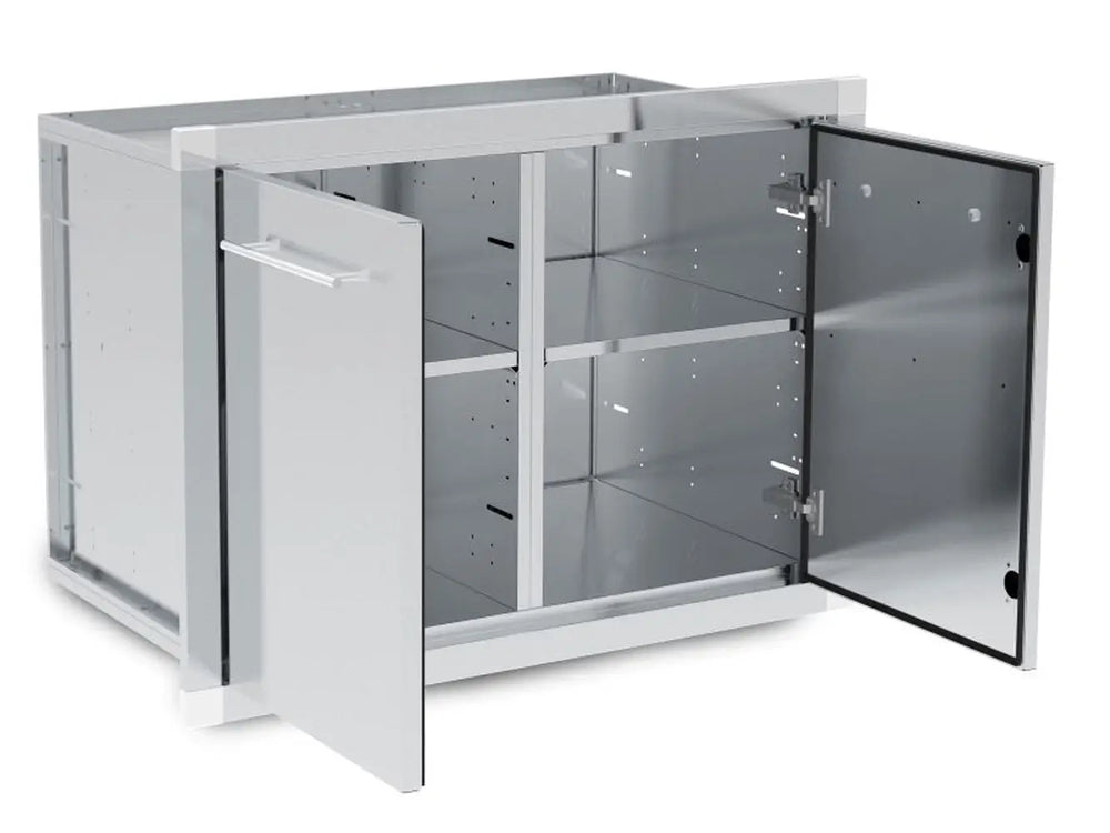 Open double doors of the Broil King 800210 storage assembly highlighting the heavy-duty hinges and internal shelf space.