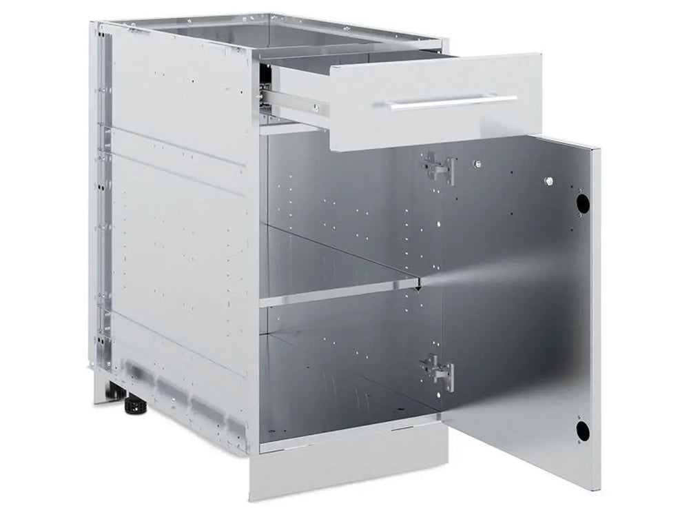 Interior view of Broil King 802300 modular cabinet base showing open top drawer and bottom storage door with internal shelf for outdoor BBQ islands.