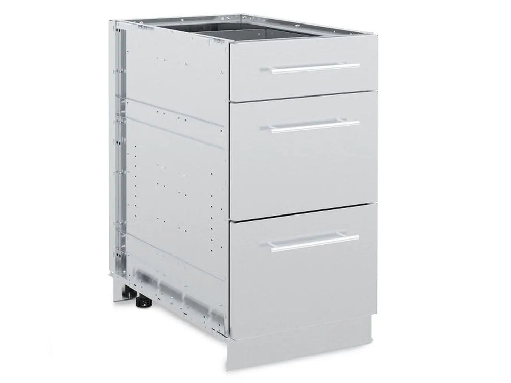 An exterior, three-quarter view of the Broil King 802500 stainless steel 3-drawer cabinet storage base with all drawers closed, showing the modern handles and modular frame construction.