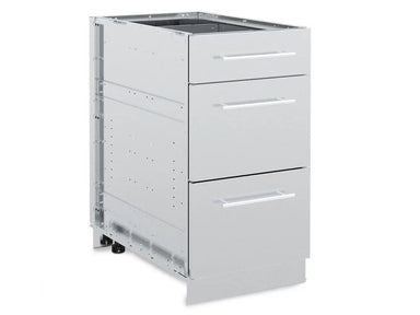 An exterior, three-quarter view of the Broil King 802500 stainless steel 3-drawer cabinet storage base with all drawers closed, showing the modern handles and modular frame construction.