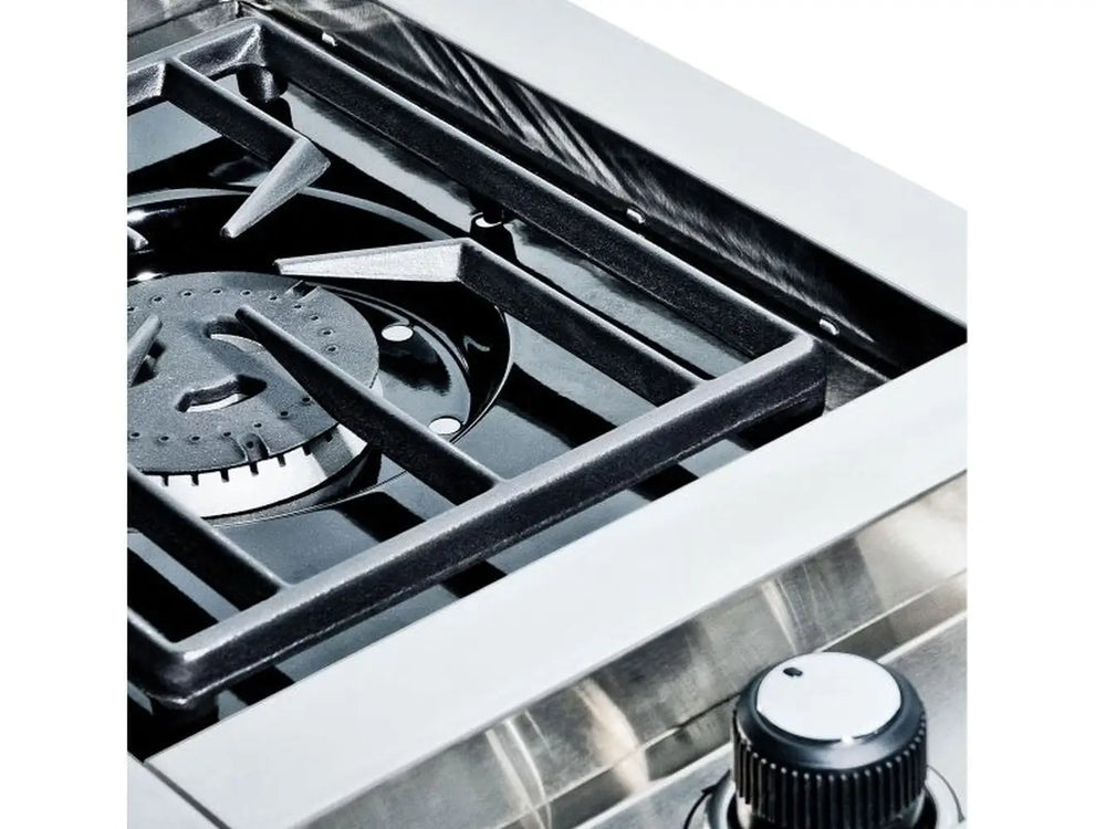 High-angle detail of the Broil King Imperial S100 cast iron grate and burner assembly.