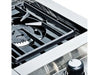 High-angle detail of the Broil King Imperial S100 cast iron grate and burner assembly.