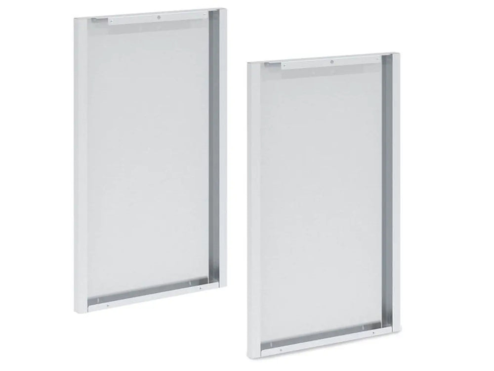 An angled perspective view of two silver Broil King 803060 Corner Cabinet Rear Panel Finishes, showing the depth of the frame and the metal's texture, against a white background.