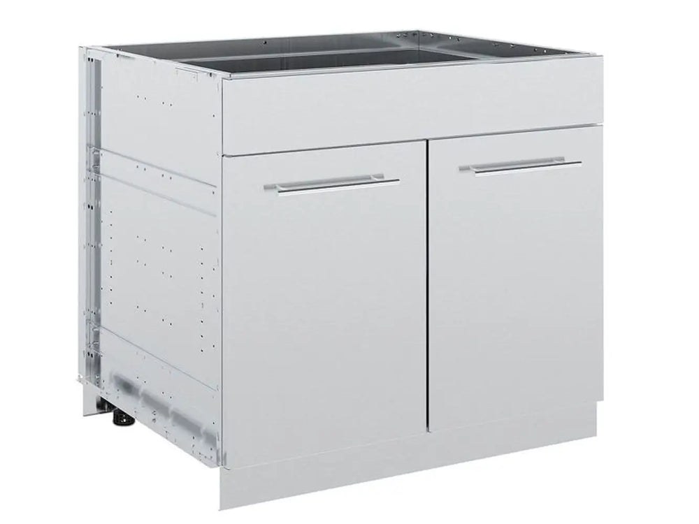 Broil King 804200 stainless steel 2-door outdoor kitchen cabinet storage base, closed front angle view showing sleek door handles and modular side panels.