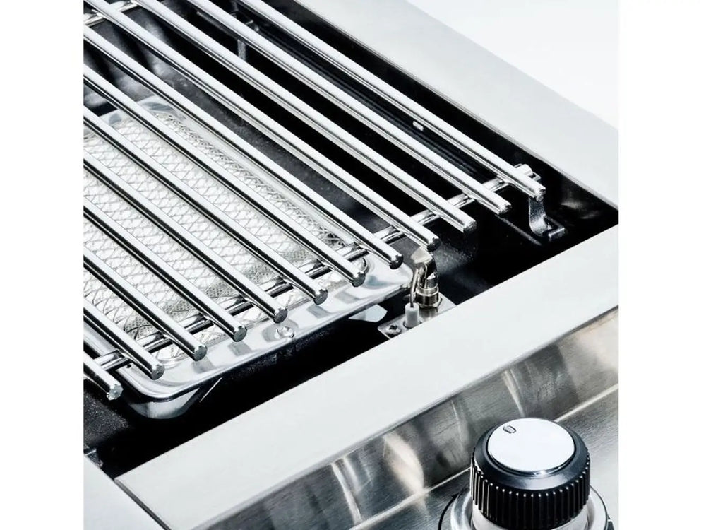 Close-up of the ceramic infrared burner element and professional-grade cooking grate on the Broil King Imperial S100.