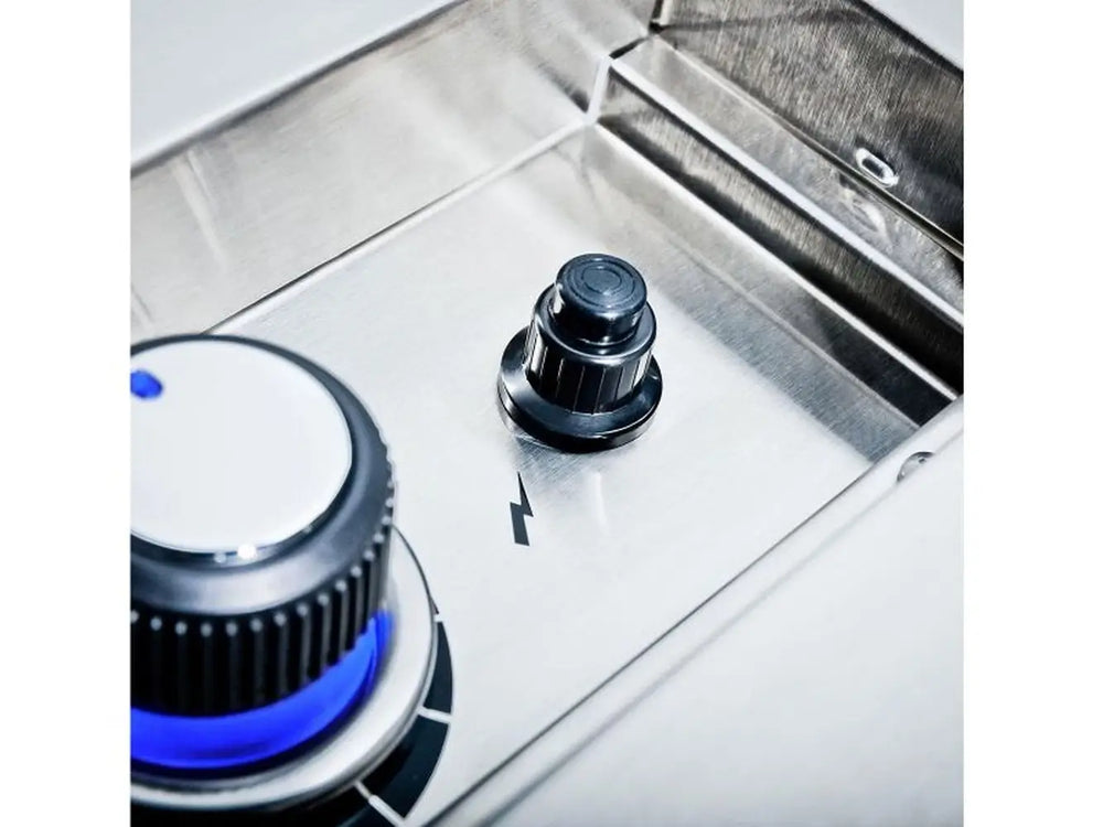 Detailed view of the Broil King Imperial S100 control panel featuring a blue LED-lit knob and electronic ignition button.