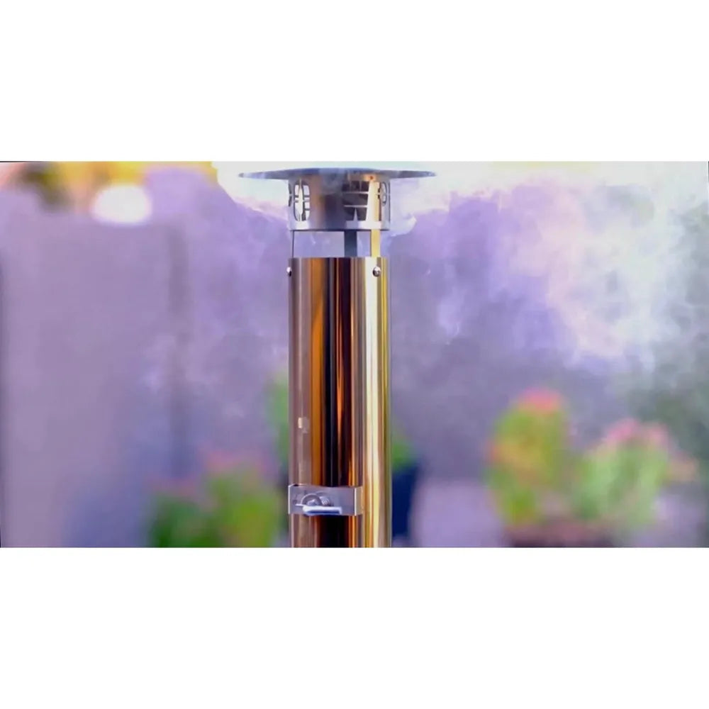 Stainless steel WPPO Karma 42 wood-fired oven chimney detail with outdoor garden background.