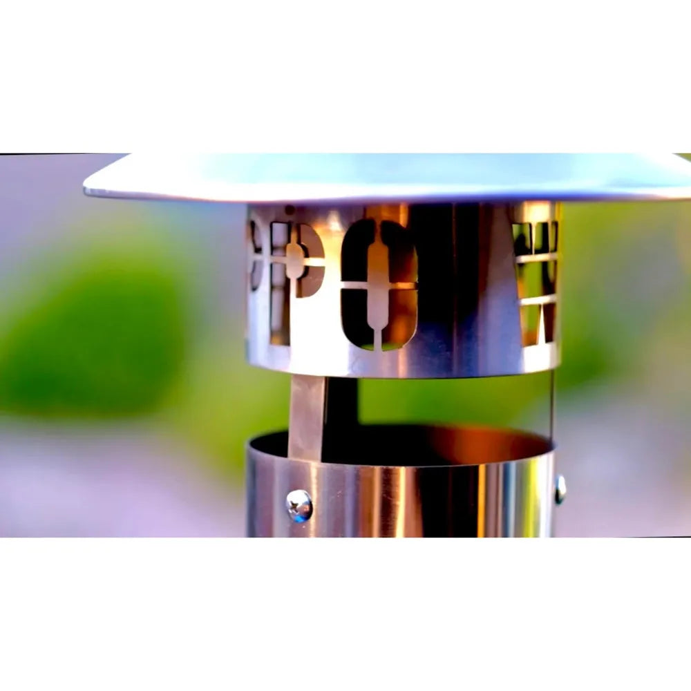 Close-up of WPPO Karma 42 stainless steel chimney cap and vented flue for wood-fired oven airflow.