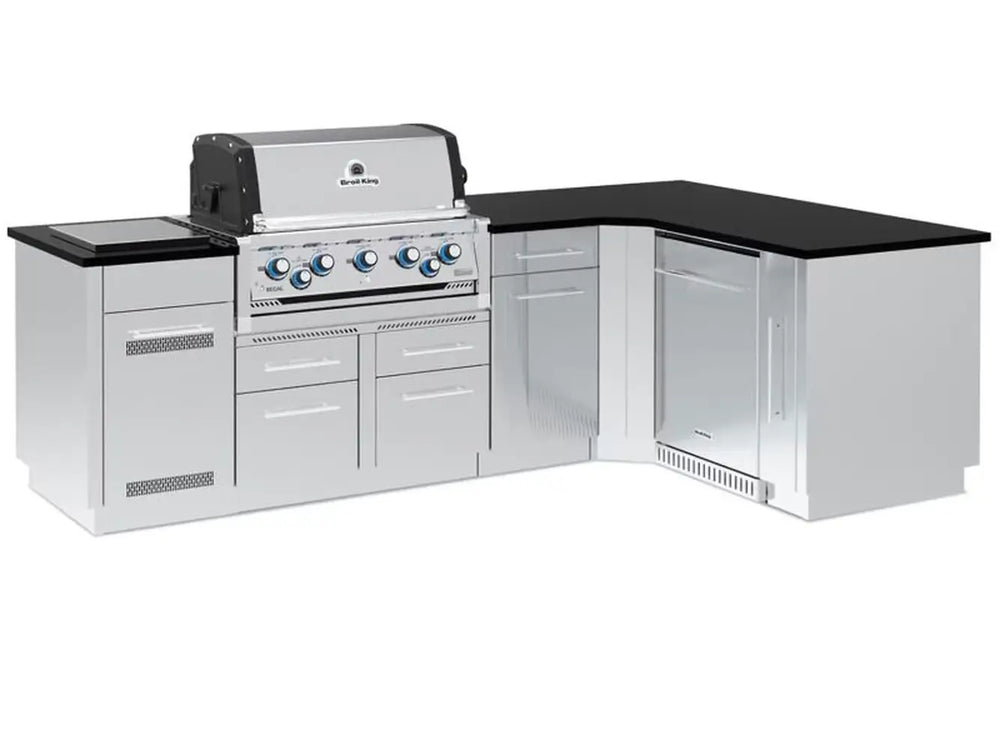 Full view of a Broil King Imperial S 590i outdoor kitchen island featuring a stainless steel built-in gas grill, black countertop, and integrated refrigerator.