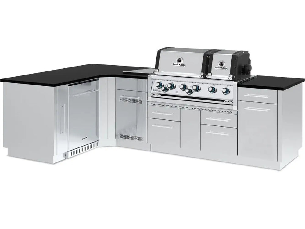 Fully assembled Broil King Imperial S 690iJ Grill Island with dual ovens, L-shaped configuration, and integrated storage.