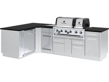 Fully assembled Broil King Imperial S 690iJ Grill Island with dual ovens, L-shaped configuration, and integrated storage.