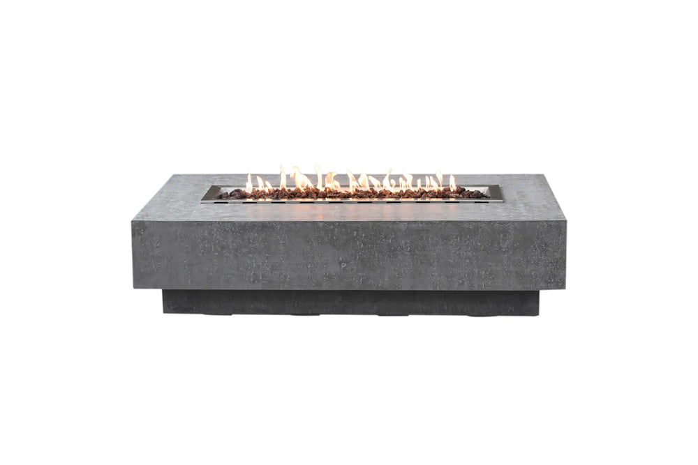 Lit Elementi Hampton OFG139LG Fire Table 56" in light gray GFRC with linear flames and lava rocks.