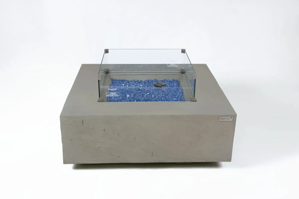 Close-up of Capertee fire table glass wind guard and space gray GFRC texture.