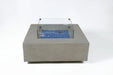 Close-up of Capertee fire table glass wind guard and space gray GFRC texture.