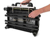 Underside view of the Broil King Porta-Chef Stove 200 with four black legs being attached for portable setup.