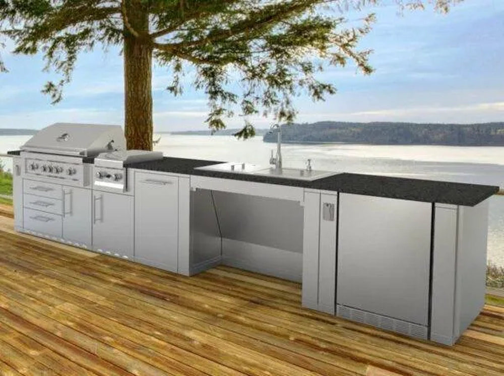 Complete Sunstone stainless steel outdoor kitchen island installation featuring the ADA44BC wheelchair accessible sink base.