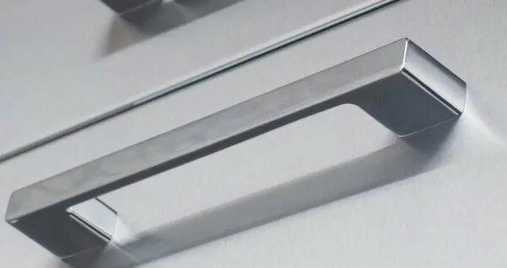 Sunstone P-BHandle signature series beveled handle, brushed stainless rectangular bar pull with 6-1/4 inch center-to-center spacing, close-up on panel background.