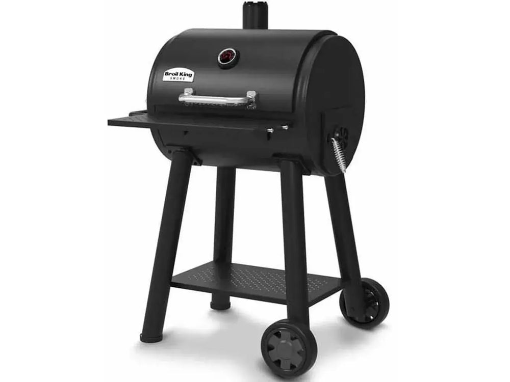 Side-angle view of the Broil King Regal Charcoal Grill 400 on a wheeled cart with chimney vent and front shelf.