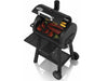 Broil King Regal Charcoal Grill 400 open with ribs, chicken, and vegetables cooking on cast iron grates.
