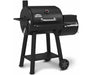 Side-angle product shot of the Broil King Regal Charcoal Offset 400 smoker grill with the firebox attached on the right side.