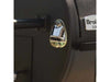 Close-up of the built-in bottle opener mounted on the side of the Broil King Regal Charcoal Offset 400 smoker grill.