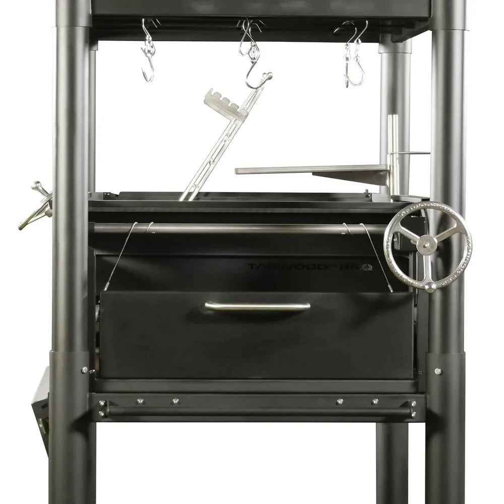 Tagwood BBQ BBQ12SI Santa Maria charcoal grill front close-up with crank wheel and ash drawer
