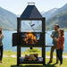Tagwood BBQ BBQ12SI Santa Maria wood fire grill with open firebox and mountain view
