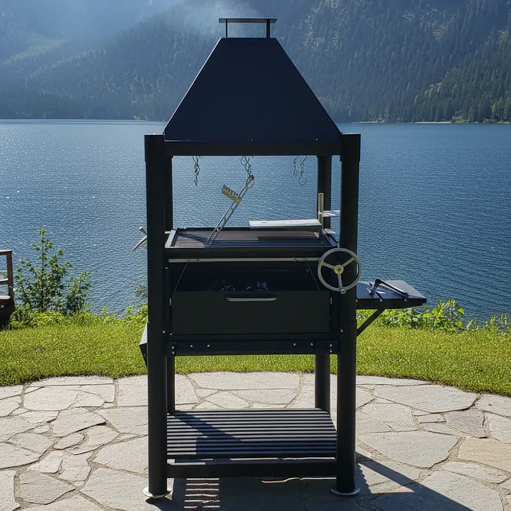 Tagwood BBQ BBQ12SI Gaucho charcoal grill with side shelf on lakeside stone patio