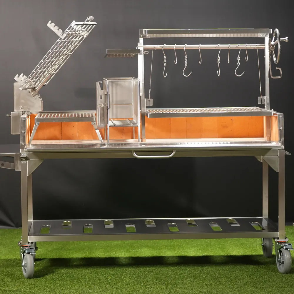 Tagwood BBQ26SS XL Santa Maria grill open firebox view with firebrick interior and adjustable grates
