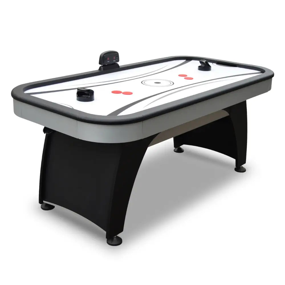 Full view of Hathaway Silverstreak air hockey table with curved black base, gray trim, LED scorer, and two black push strikers on the playfield.