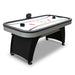 Full view of Hathaway Silverstreak air hockey table with curved black base, gray trim, LED scorer, and two black push strikers on the playfield.