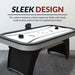 Silverstreak air hockey table with sleek design featuring black melamine cabinet, silver accents, and modern curved base for stylish game room decor.