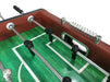  A detailed shot of the player rods and the green playing field on the Hathaway Metropolitan 54-inch Foosball Table, highlighting the shiny chrome finish on the 